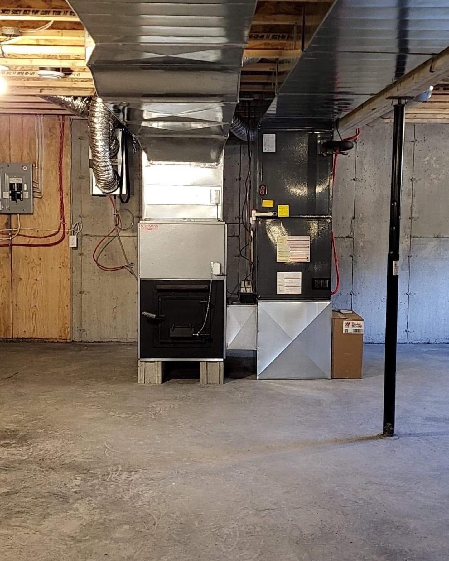 Air handler with custom ductwork in residential basement